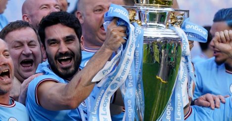 Man City midfielder Ilkay Gundogan lifts the Premier League trophy