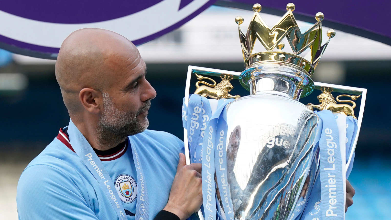 Manchester City manager Pep Guardiola with the Premier League trophy